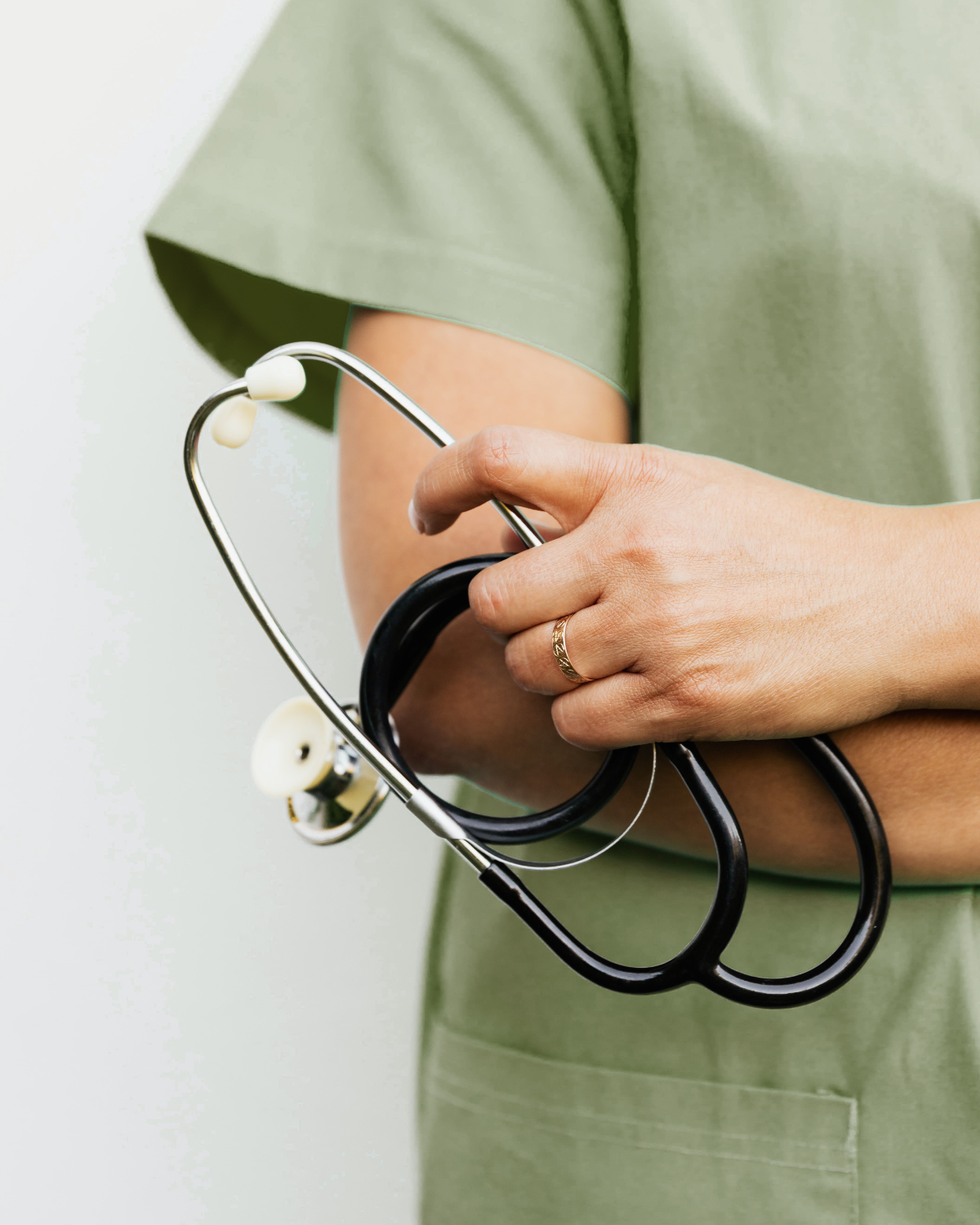 A physician holding a patient's hand